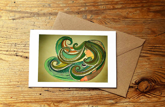 Greeting card with ocean wave design on a wooden surface