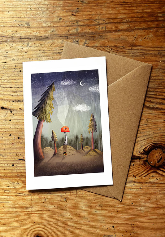 Greeting card with a nature-themed mushroom and forest illustration on a wooden surface