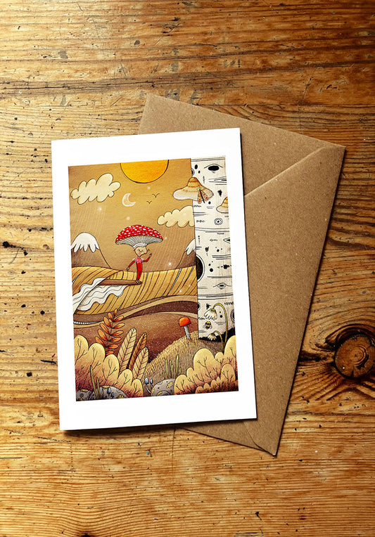Illustrated card with a character with a msuhroom hat surfing an ocean wave and a forested landscape in the foreground, on a wooden surface with a brown envelope.