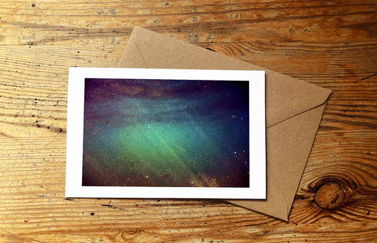 Card with an underwater photo design on a wooden surface