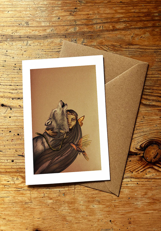 Greeting card with illustration of a woman and wolf and other wild animals on a wooden surface